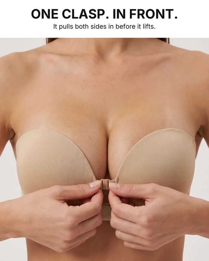 Hands fastening the centre front clasp of the strapless bra